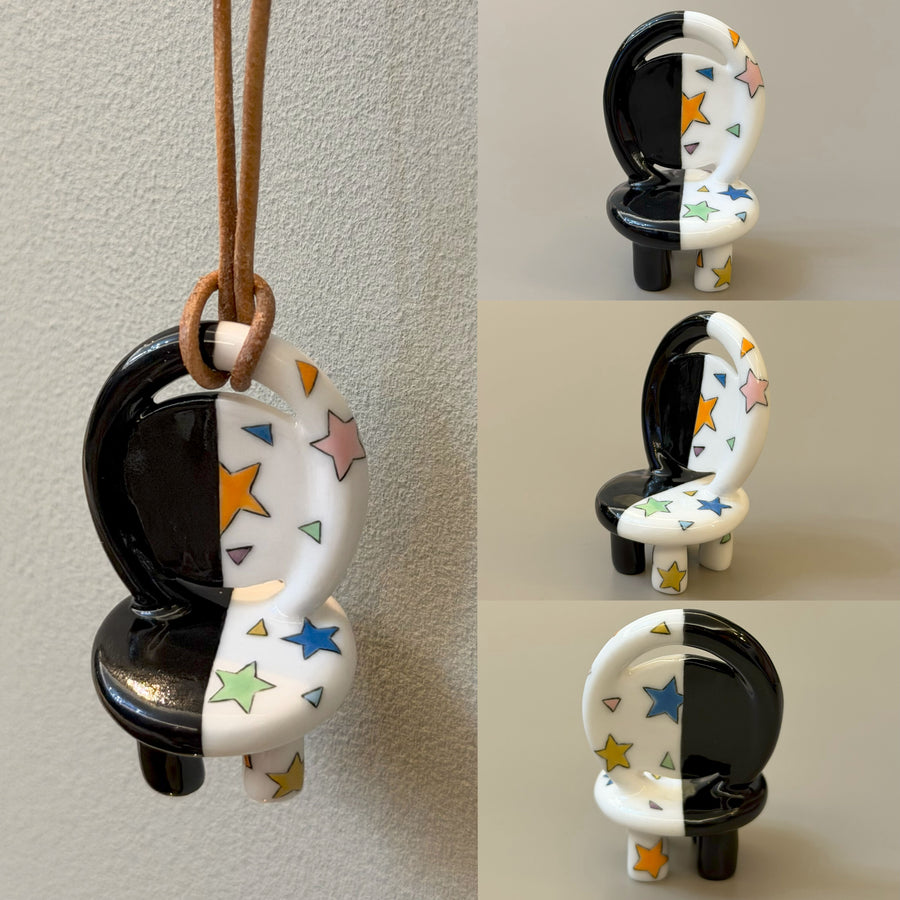 Starry Night black-and-white ceramic chair necklace with colorful stars – front view