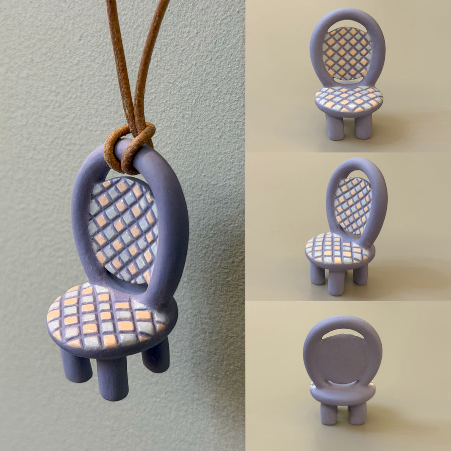 Lavender ceramic chair necklace with blue-gray and peach tiled grid