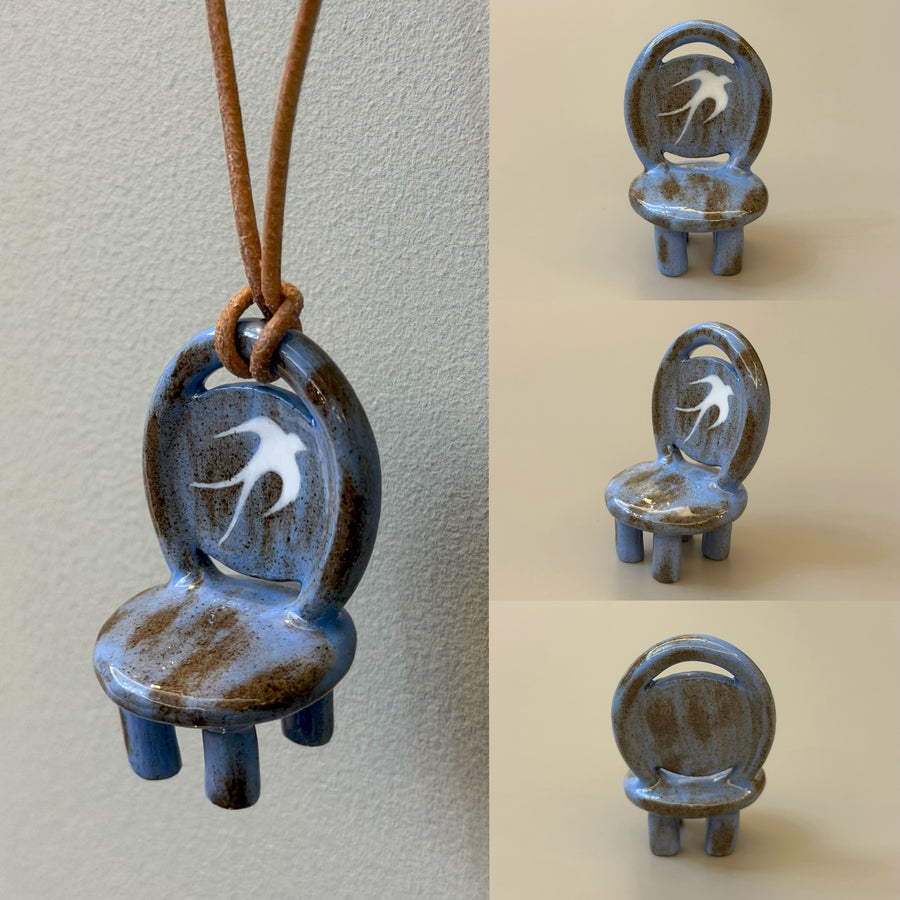 Patina Charm blue-brown ceramic chair necklace with white swallow motif