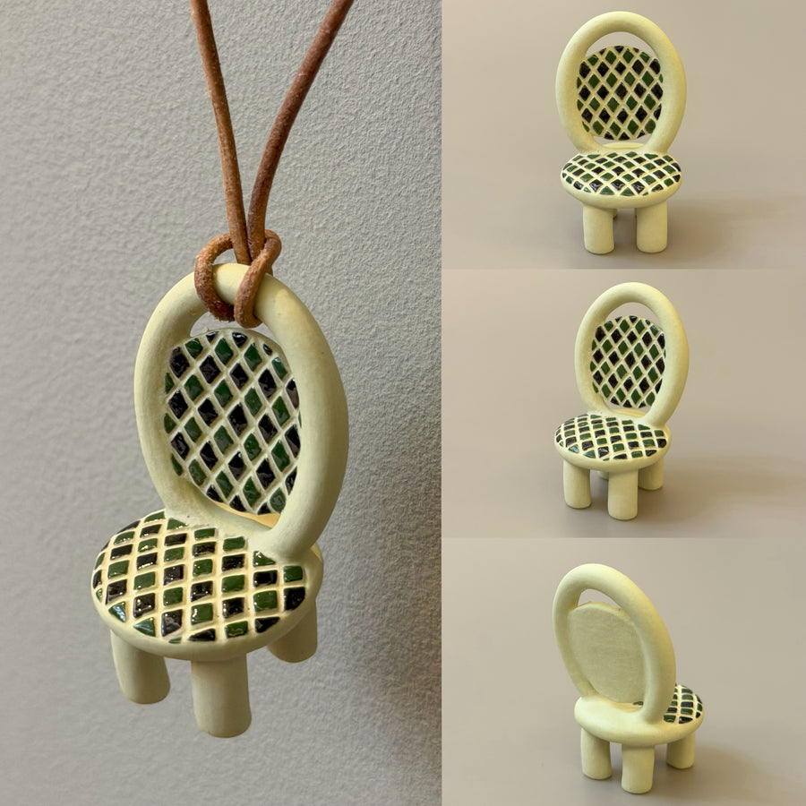 Handcrafted Squares ceramic chair necklace with cream frame and green-black grid – front view